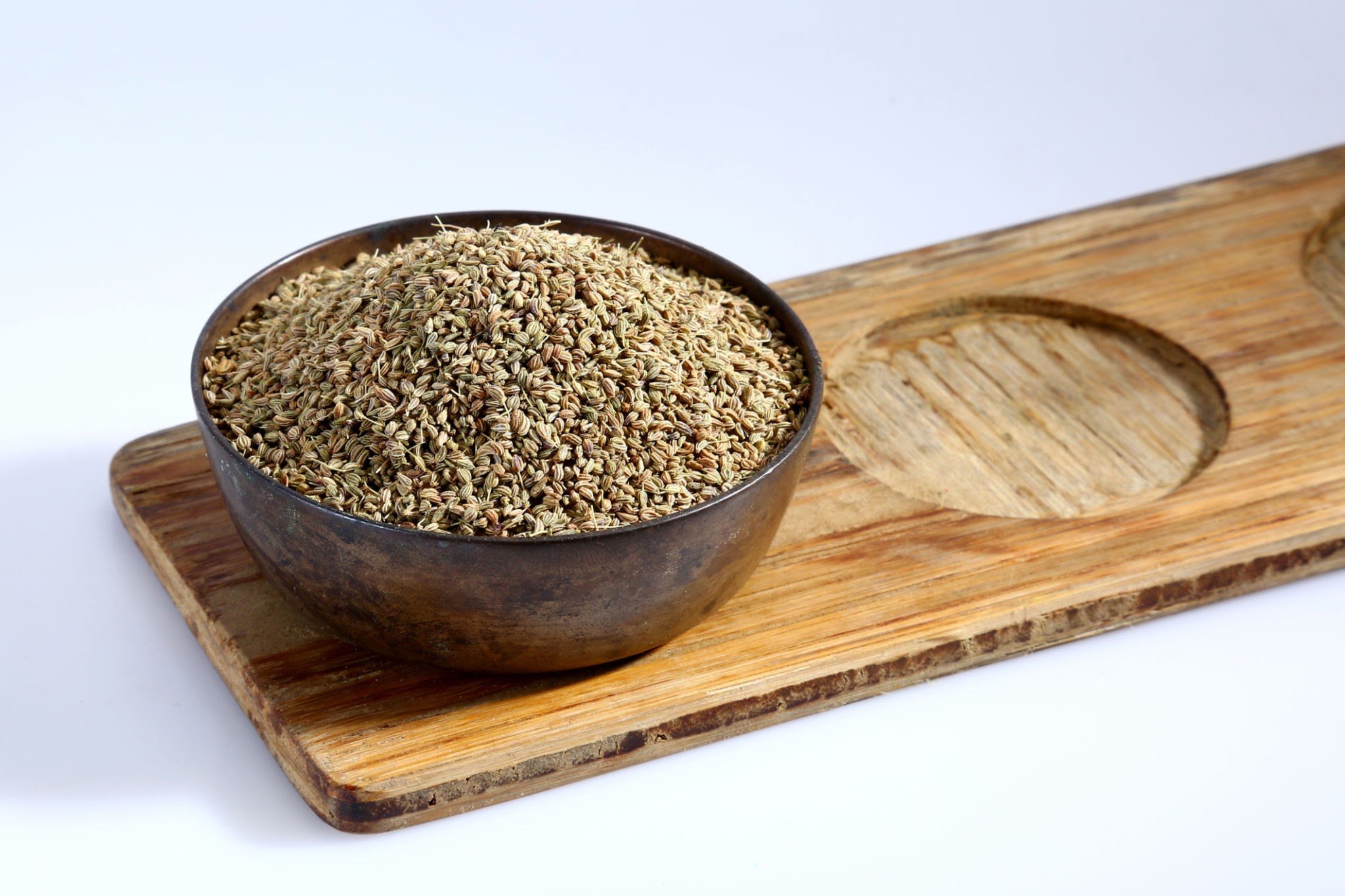 Ajwain in a Wooden bowl Ajwain in a Wooden bowl